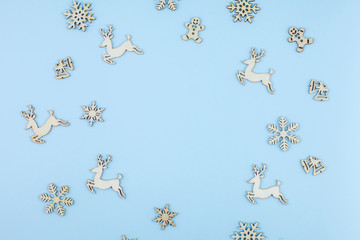 Fototapeta na wymiar Winter pattern made of snowflakes on blue background. Winter concept. Flat lay. Minimal concept