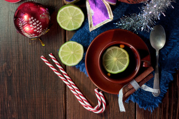 Top view of christmas tea on wooden background.