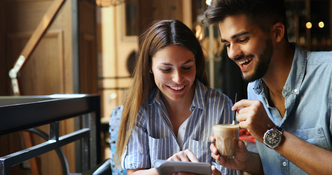 Woman And Man Flirting In Cafe