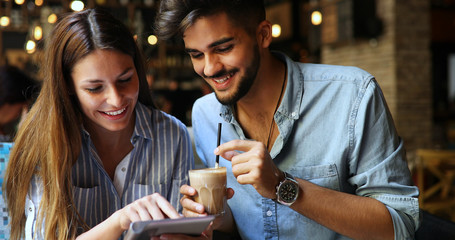 Woman and man flirting in cafe
