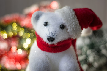 White bear toy as christmas decoration, with santa hat.