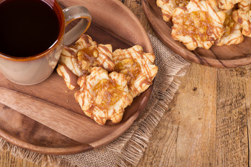 Overhead View of a Plate of Apple Caramel Cookies and Cup of Coffee