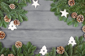 Christmas composition on wooden background with Christmas tree and pine cones. Flat lay, top view