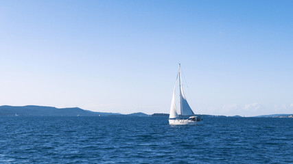 Obraz premium Sailing. Ship yachts with white sails in the Sea. Luxury boats. Boat competitor of sailing regatta.