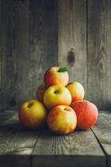 Apples on wooden background