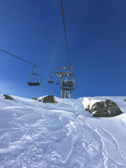 Idyllic mountain scenery, ski lift and slopes in the Alps