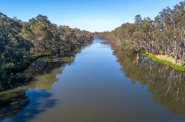 Fototapeta na wymiar Aerial view of the Goulburn river early in the morning with the trees reflecting in the water. The Goulburn river is located in Nagambie Australia