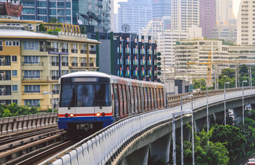 Naklejka premium BTS Sky Train is running in downtown of Bangkok. Sky train is fastest transport mode in Bangkok