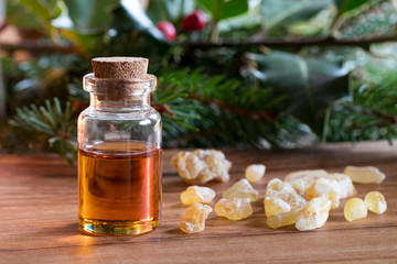 A bottle of frankincense essential oil with frankincense resin