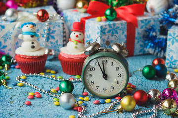 Christmas cupcakes with colored decorations made from confectionery mastic