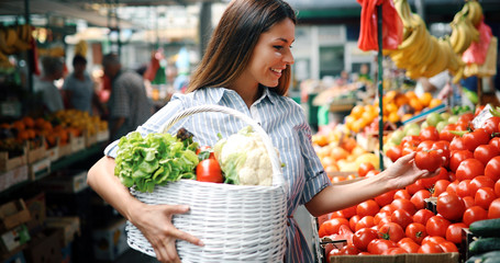 Picture of woman at marketplace buying fruits