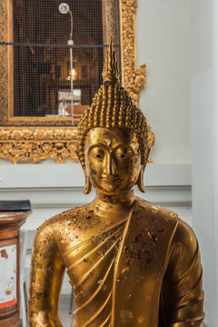 A golden buddha statue at Wat Pho, in Bangkok, Thailand.