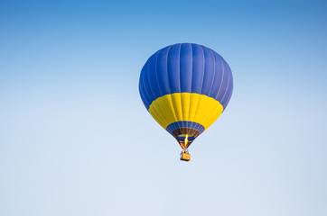 Colorful of hot air balloon with fire and blue sky background