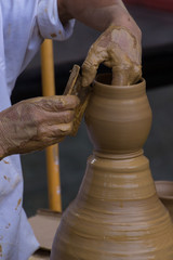 Potter Shaping a Clay Pot