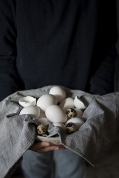 White eggs in a grey cloth linen