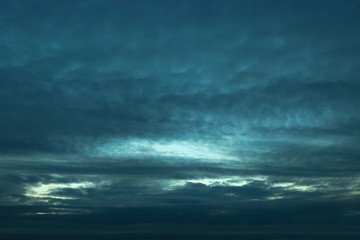 Naklejka na ściany i meble Dark blue clouds and sky