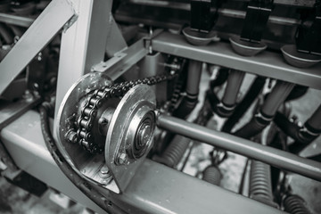 Industrial roller chain, technology background with selective focus