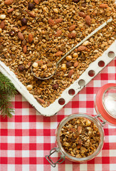 Homemade granola on a baking sheet in festive decoration. Rustic style.