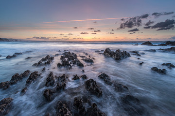 summer sunset on Asturian coast with the sea in long exposure