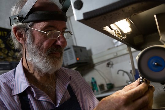 Goldsmith working in workshop