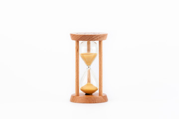 Sandglass, hourglass or egg timer on white table showing the last second or last minute or time out.