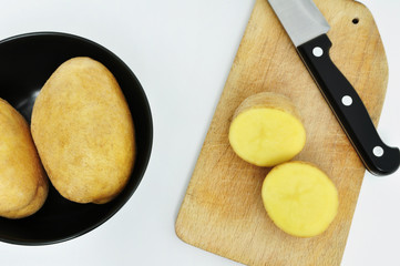 potato cutting on the board