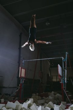 Male gymnast practicing gymnastic exercise