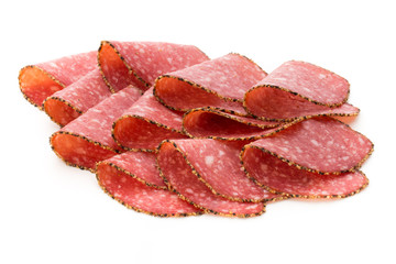 Salami slices isolated on the white background.