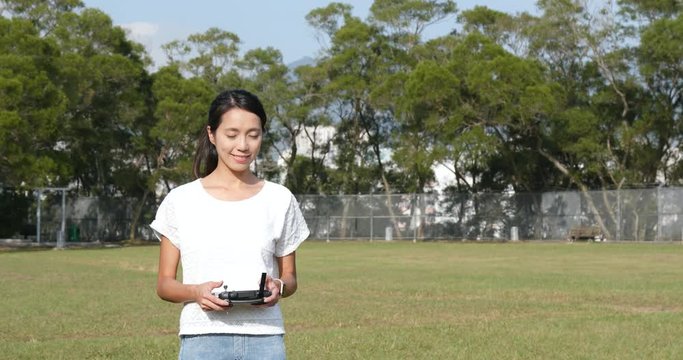 Woman control fly drone