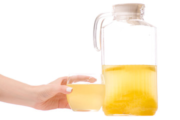 Decanter with a lemonade glass of hands