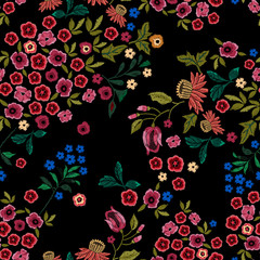Embroidery ethnic seamless pattern with small wild flowers.