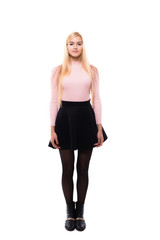 Fototapeta premium Attractive young fashion model wearing dress in studio and smiling