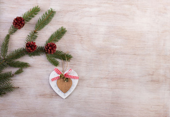 Heart Christmas decoration on fir branch