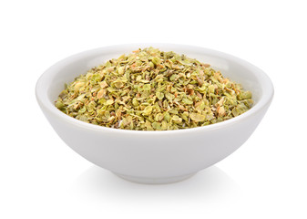 Oregano spice in a bowl on white background
