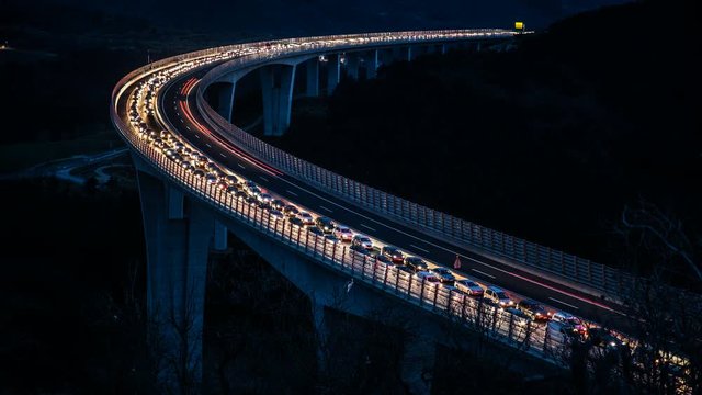 Traffic jam on bridge at night moving fast forward 4K