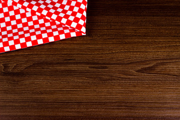 wooden table with plaid tablecloth