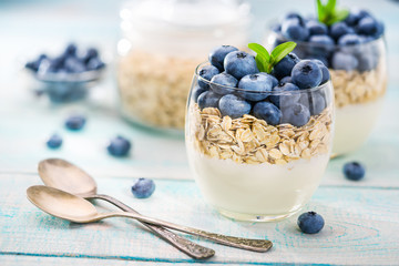Dessert with sweet milk cream, fresh blueberry  and oatmeal, close up