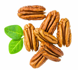 Pecans piles  with green leaves,top view