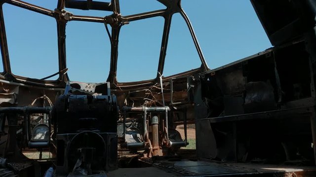 Old military airplane wreckage cockpit view of the sky through abandoned metal remans of the lonely plane | 2017 | 4k