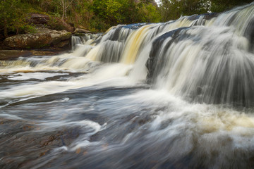 Fototapeta premium View of peaceful waterfall in the tropical rainforest, waterfall in Phu Kradueng National Park, Loei Province, Thailand