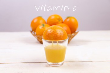 Fresh orange juice squeezed from fruit into glass, photo manipulation 