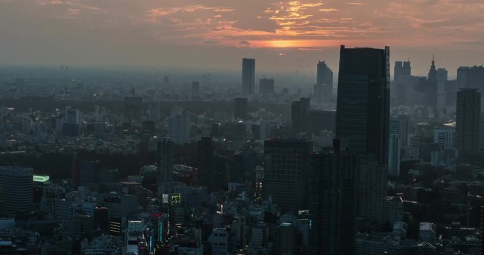 TOKYO, JAPAN – JUNE 2016 : Timelapse over central Tokyo cityscape during beautiful sunset from Tokyo Tower with tall buildings in view