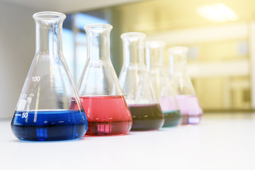 Flasks close up equipment in laboratory background