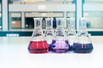 Flasks close up equipment in laboratory background