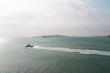 Backlit island in the sea