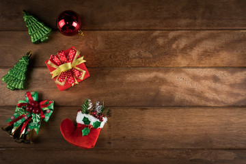 christmas background gift box and decoration on brown wooden table surface.Flat lay.Top view with copy space on right