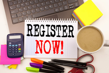Word writing Register Now in the office with surroundings such as laptop, marker, pen, stationery, coffee. Business concept for Internet Registration Subscribe Workshop white background