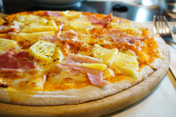 Hawaiian Pizza on Wooden Board