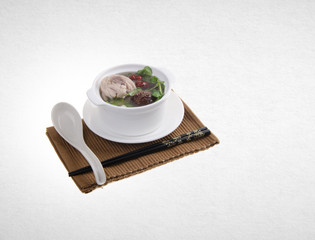 herb soup or chinese herb soup on a background.