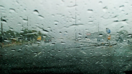 Heavy rain on the freeway bridge.